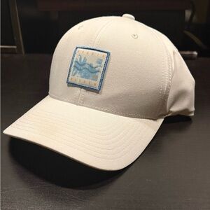Travis Mathew White Cap with Blue Logo